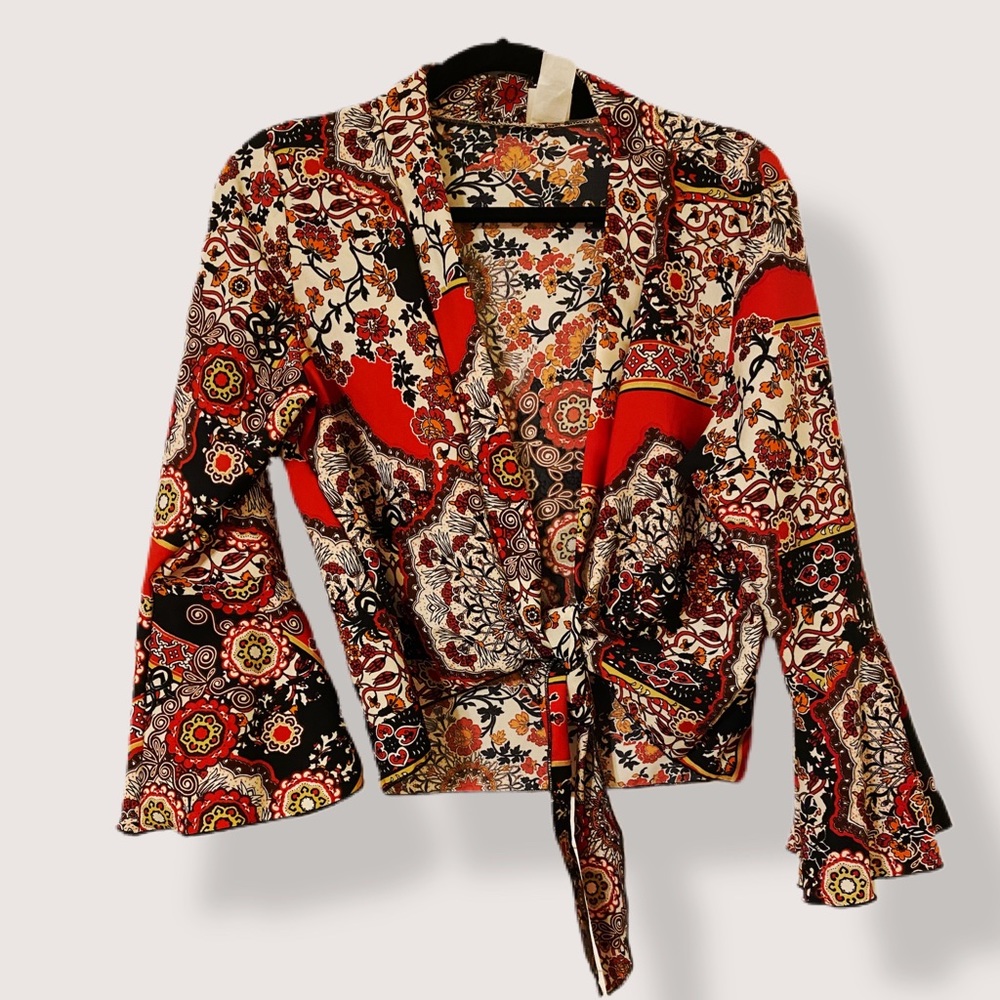 Ebuh cropped, tie front, wrap / blouse with bell sleeve. Polyester. Hand wash.